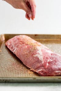 seasoning ribs with spices.