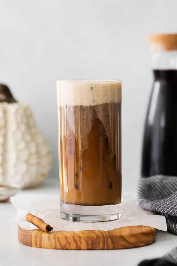 Pumpkin Cream Cold Brew in a glass poured over ice. 