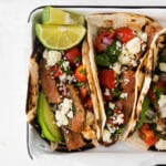Tasty steak tacos with a twist of feta cheese and tomatoes.