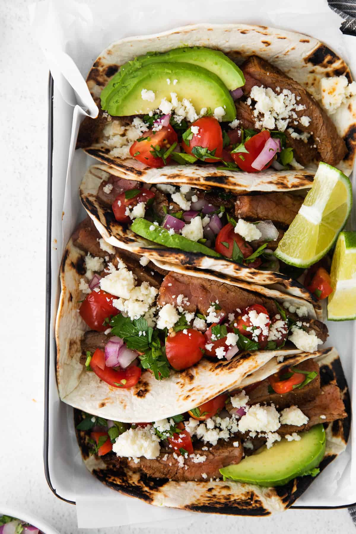 steak tacos side by side ready to be served