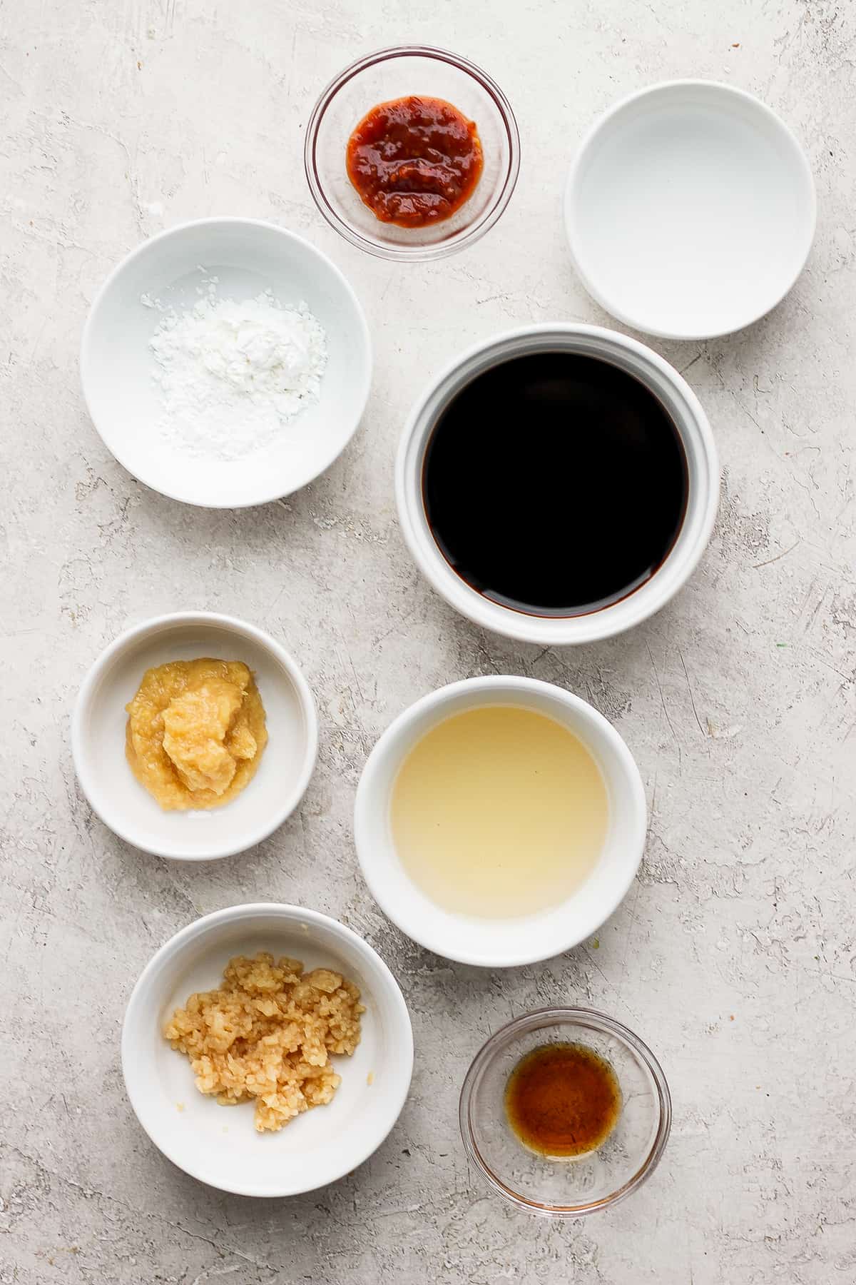 stir fry sauce ingredients in bowls ready to be mixed together