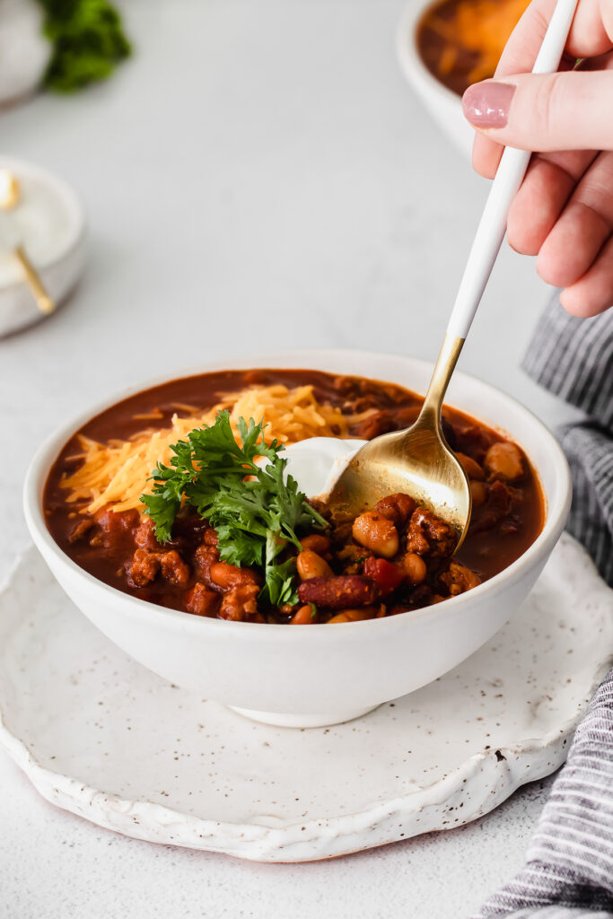 instant ، chili in a bowl with a s،.