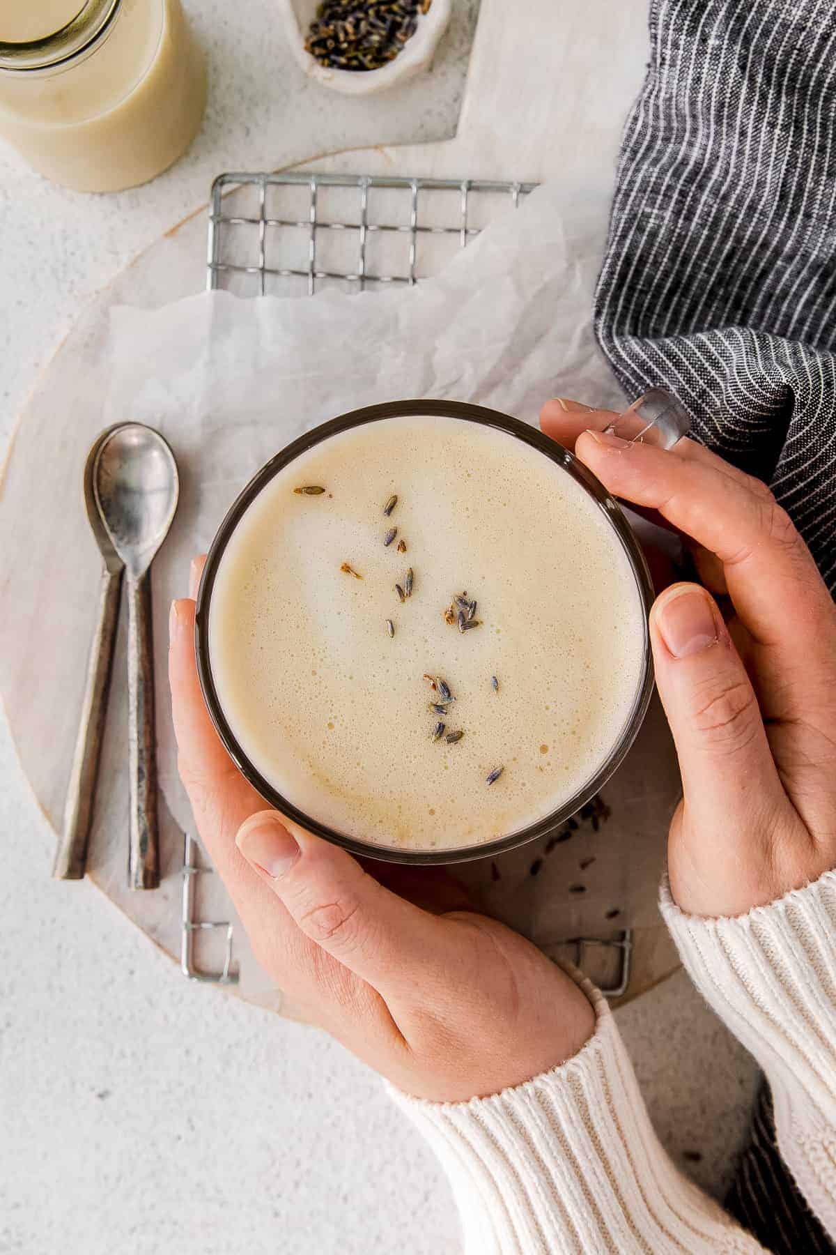 london fog drink in a mug with hands holding it