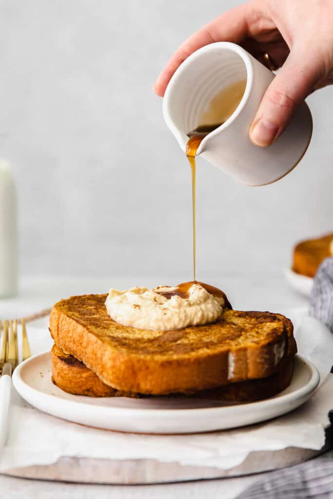 Drizzling maple syrup over the pumpkin french toast. 