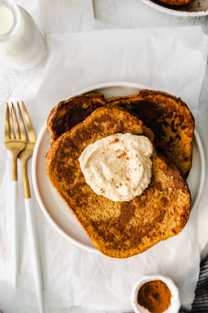 Pumpkin french toast topped with coconut whipped cream. 