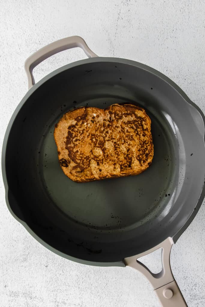Cooking pumpkin french toast in a skillet pan. 