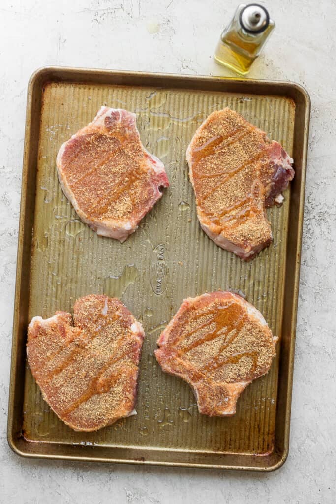 pork chops on baking sheet