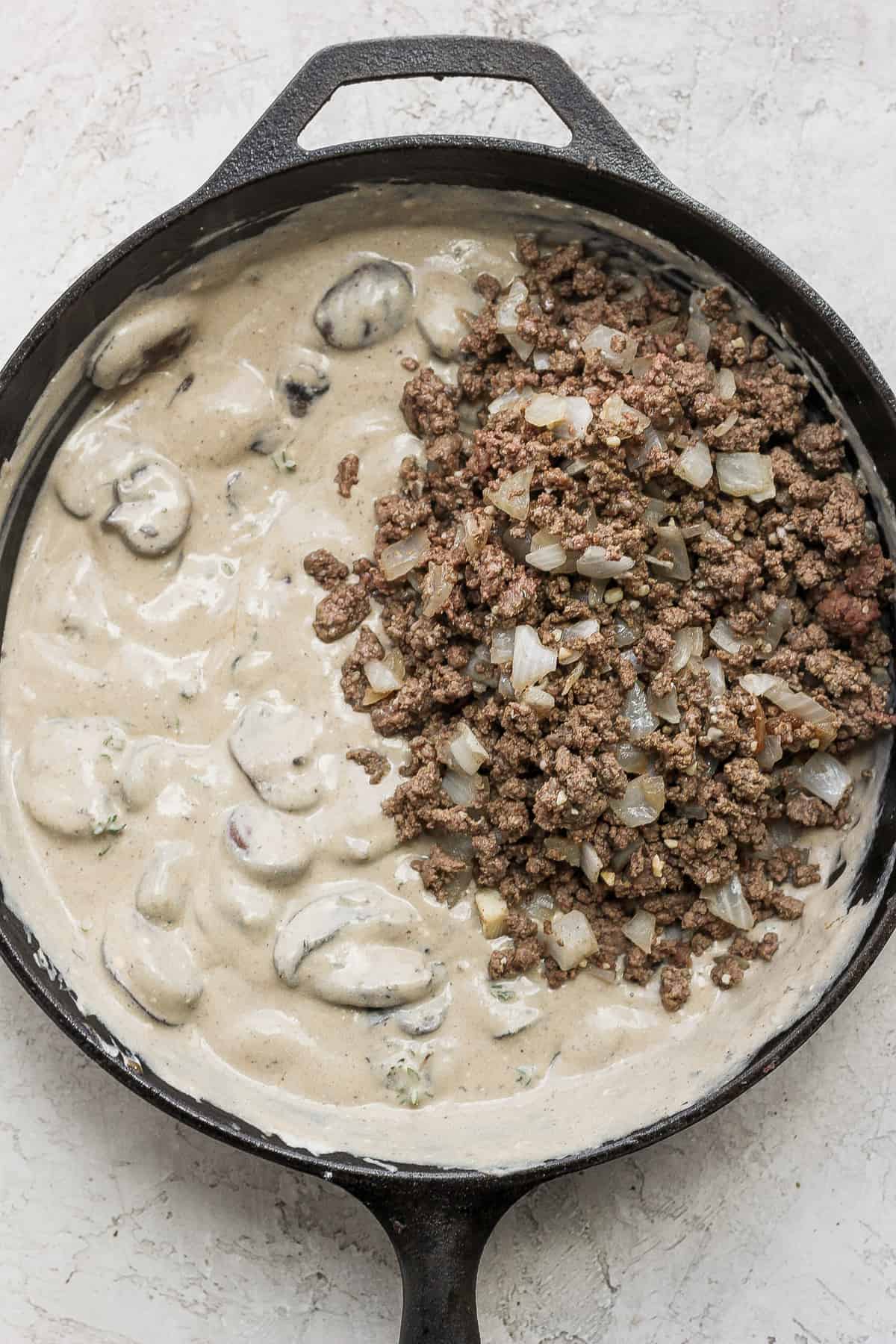 ground beef stroganoff sauce in a cast iron skillet