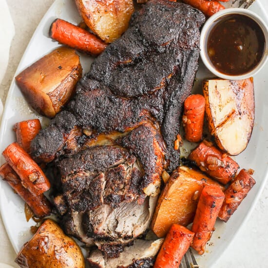 pork roast with veggies on platter.