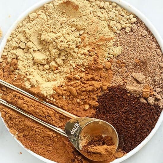 a bowl full of ingredients for a pumpkin spice latte, including pumpkin pie spice.