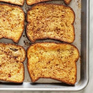 sliced french toast on a baking sheet.