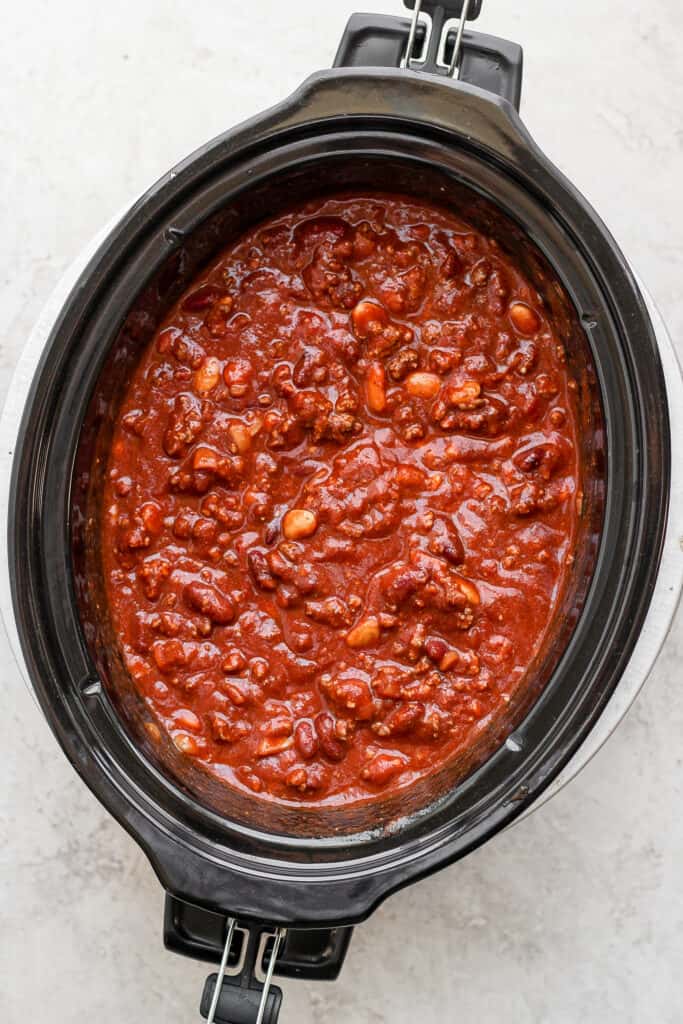 Slow cooker chili in a slow cooker looking delicious.