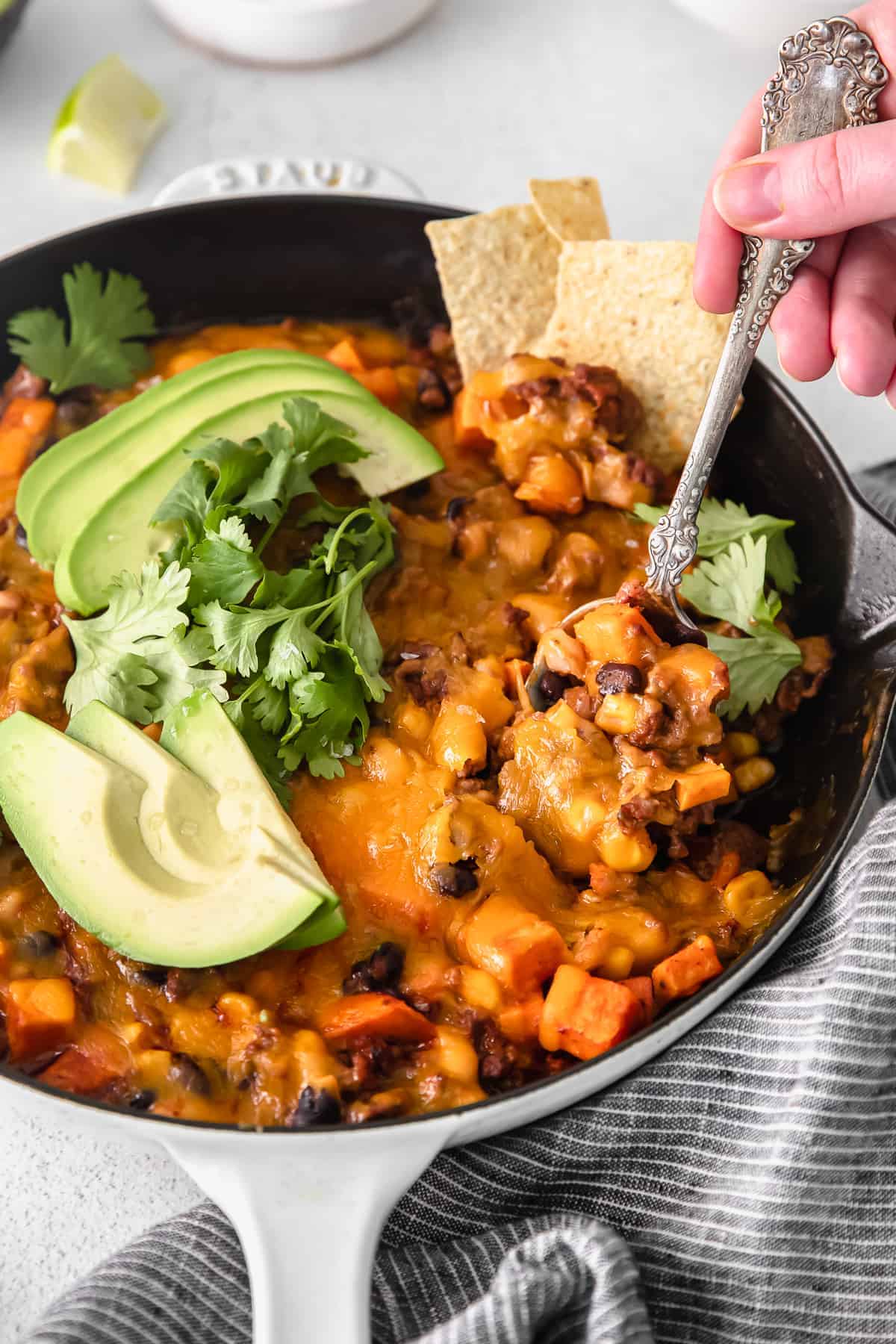 turkey sweet potato enchilada skillet on a spoon