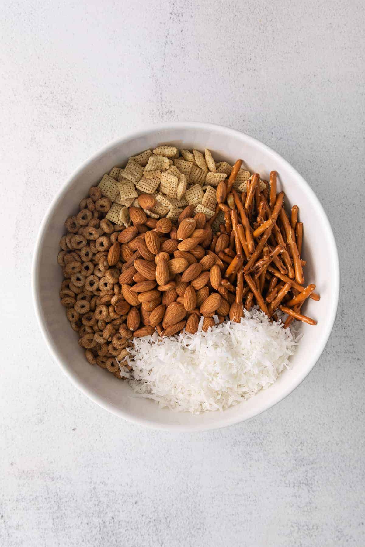 Ingredients for chai chex mix in a bowl. 