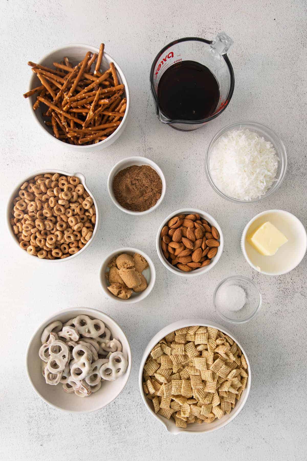 The ingredients for chai chex mix on the counter. 