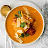 Chicken enchilada soup in a bowl.