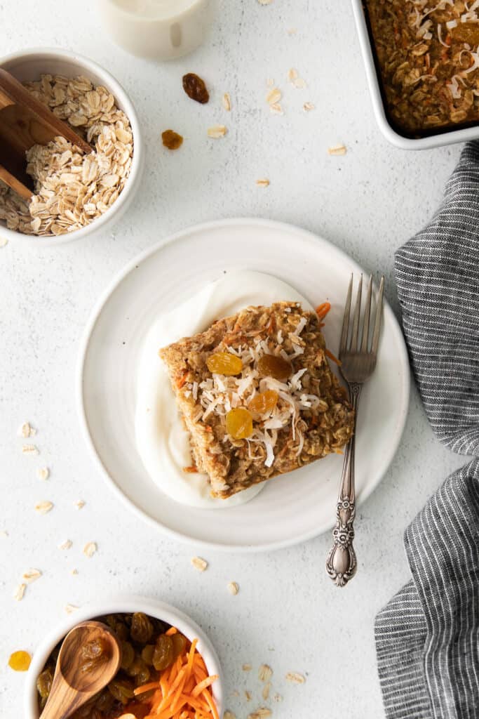 slice of morning glory baked oatmeal on a plate with a fork