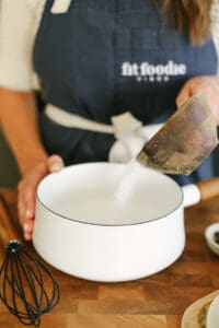 whisking salt with water in pot.