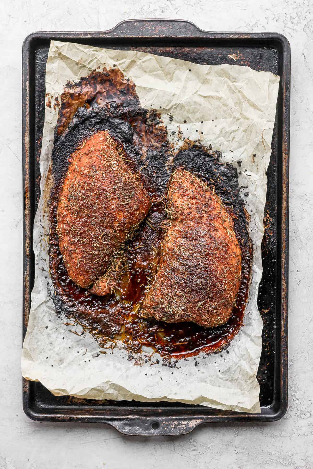 baked tenderloin on baking sheet.