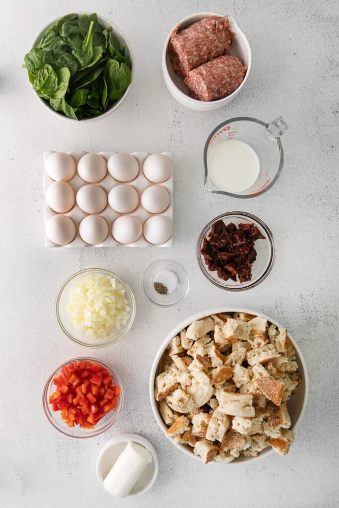 Sausage, eggs, sun dried tomatoes, milk, and other breakfast bake ingredients.  