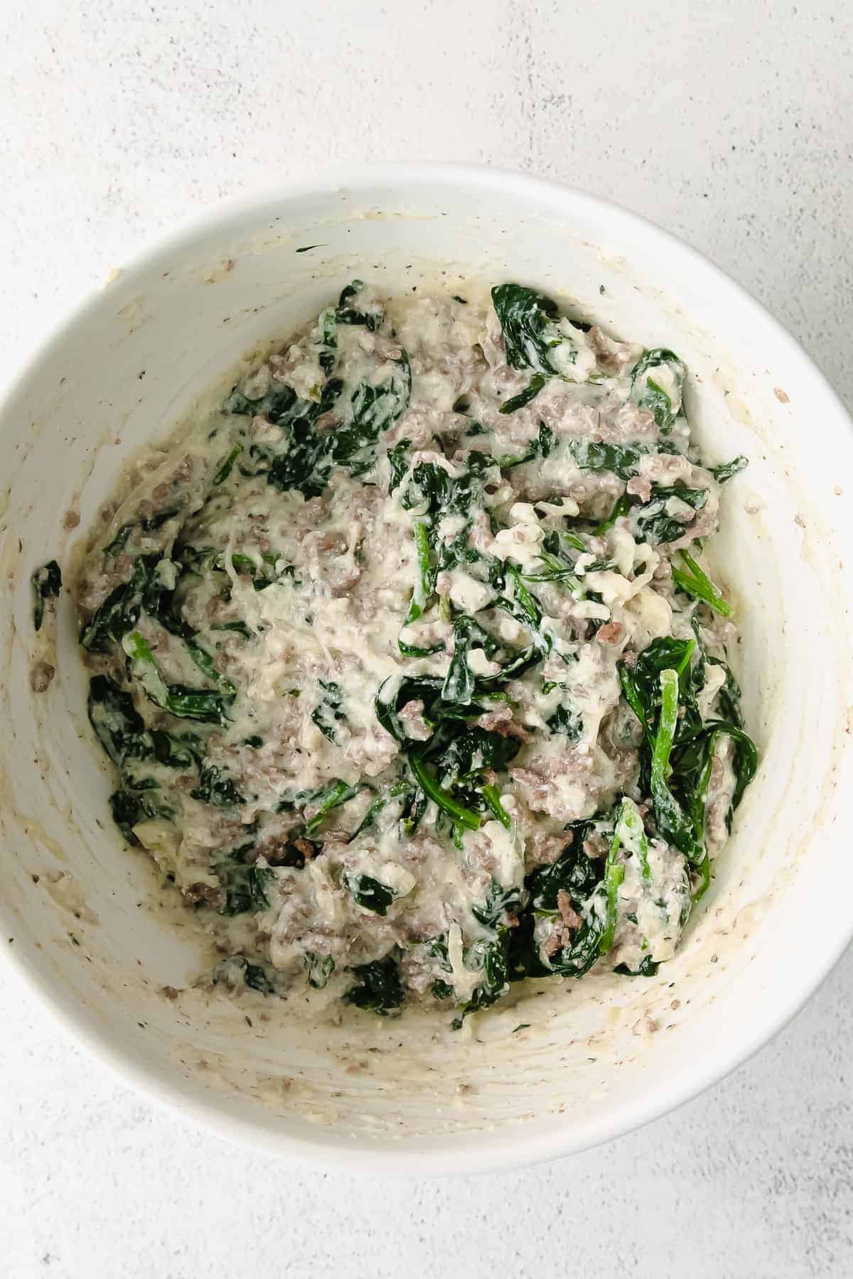 Lasagna roll up filling in a bowl. 