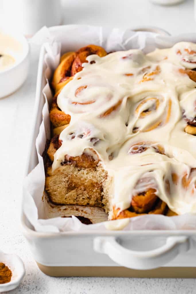 maple cinnamon rolls topped with cream cheese frosting