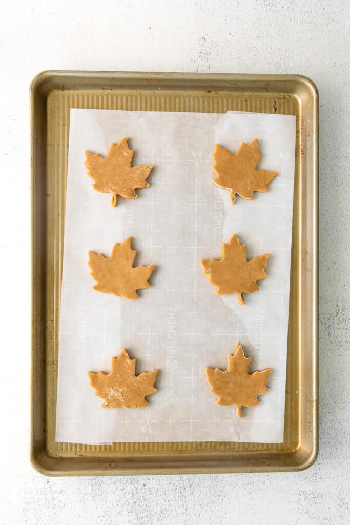 sugar cookie cut outs on baking sheet