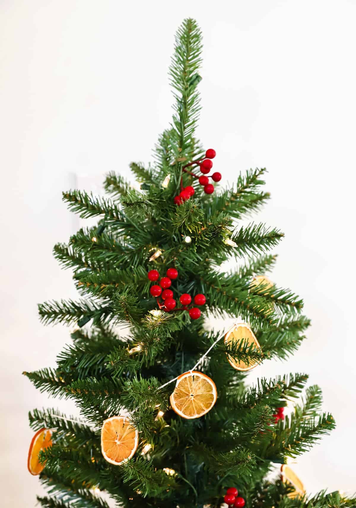 orange garland on christmas tree