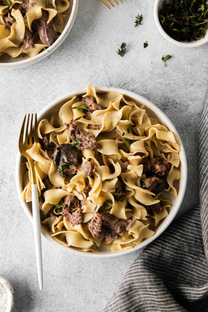 bowl of beef stroganoff with a fork