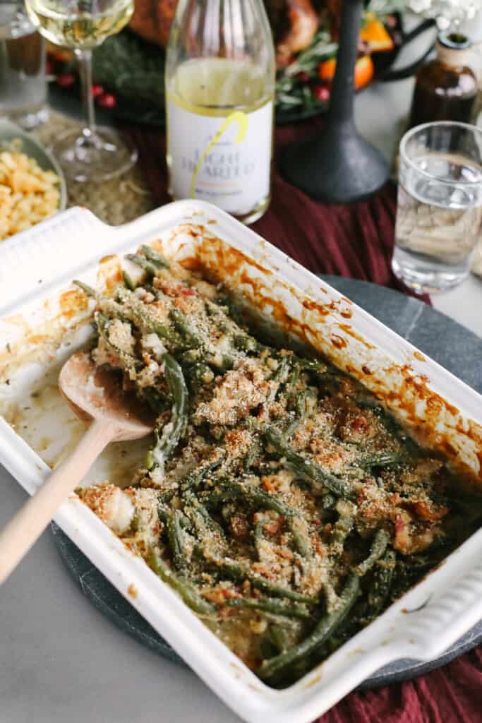 green bean casserole with bacon in a casserole dish