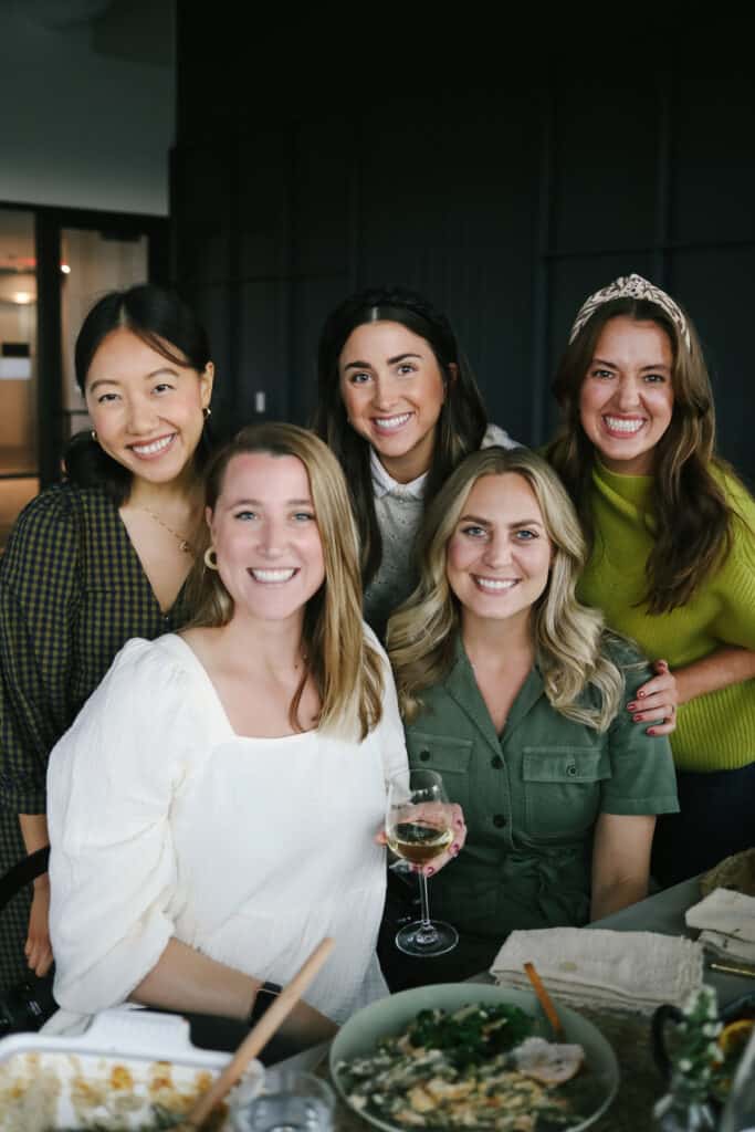 5 women sitting at a thanksgiving table