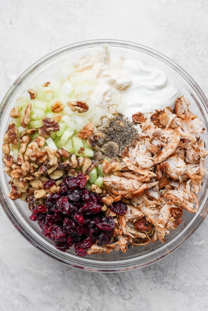 A bowl of turkey salad ingredients. 