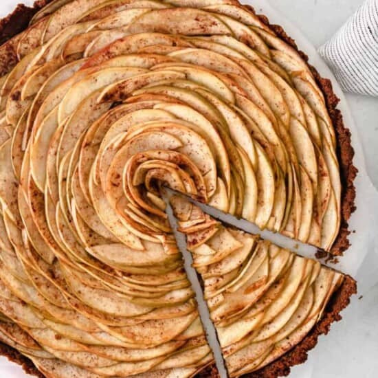 Apple Tart with a slice being removed