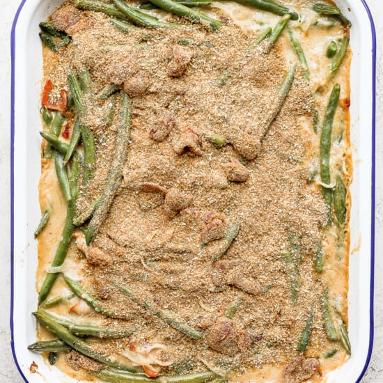 A casserole dish filled with green beans and meat.