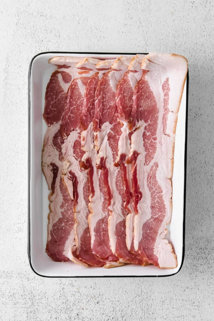 uncooked bacon in dish