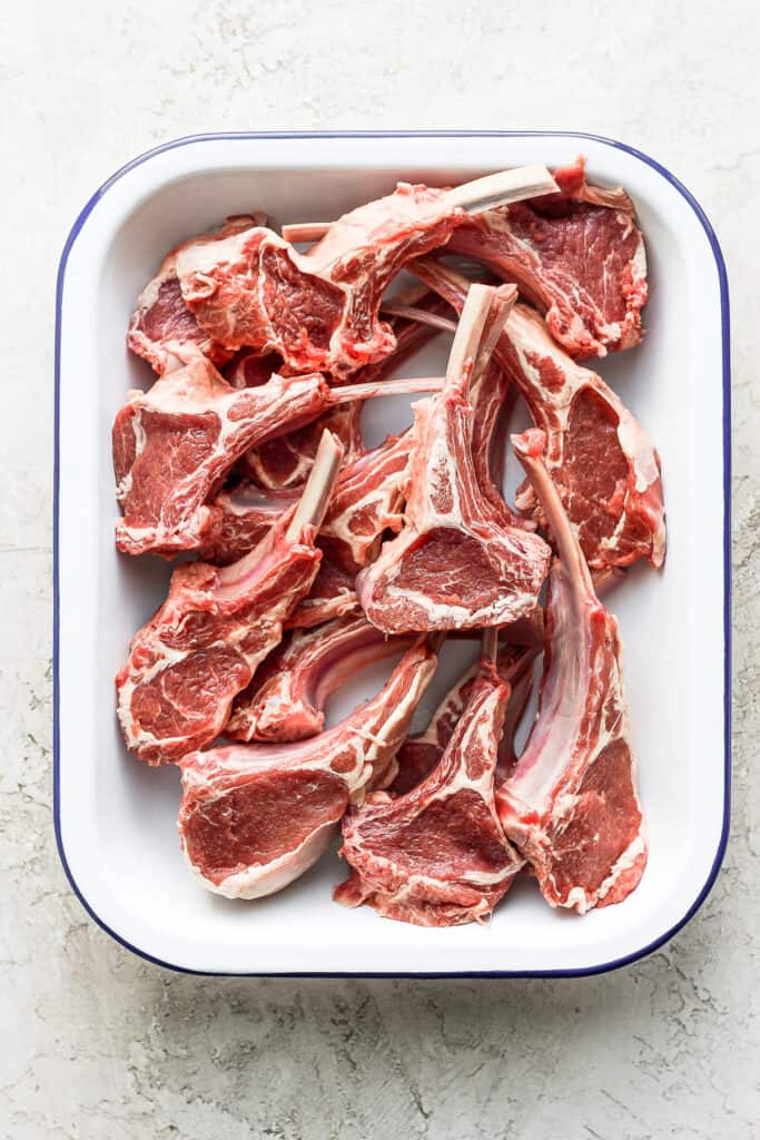 raw lamb chops in a dish