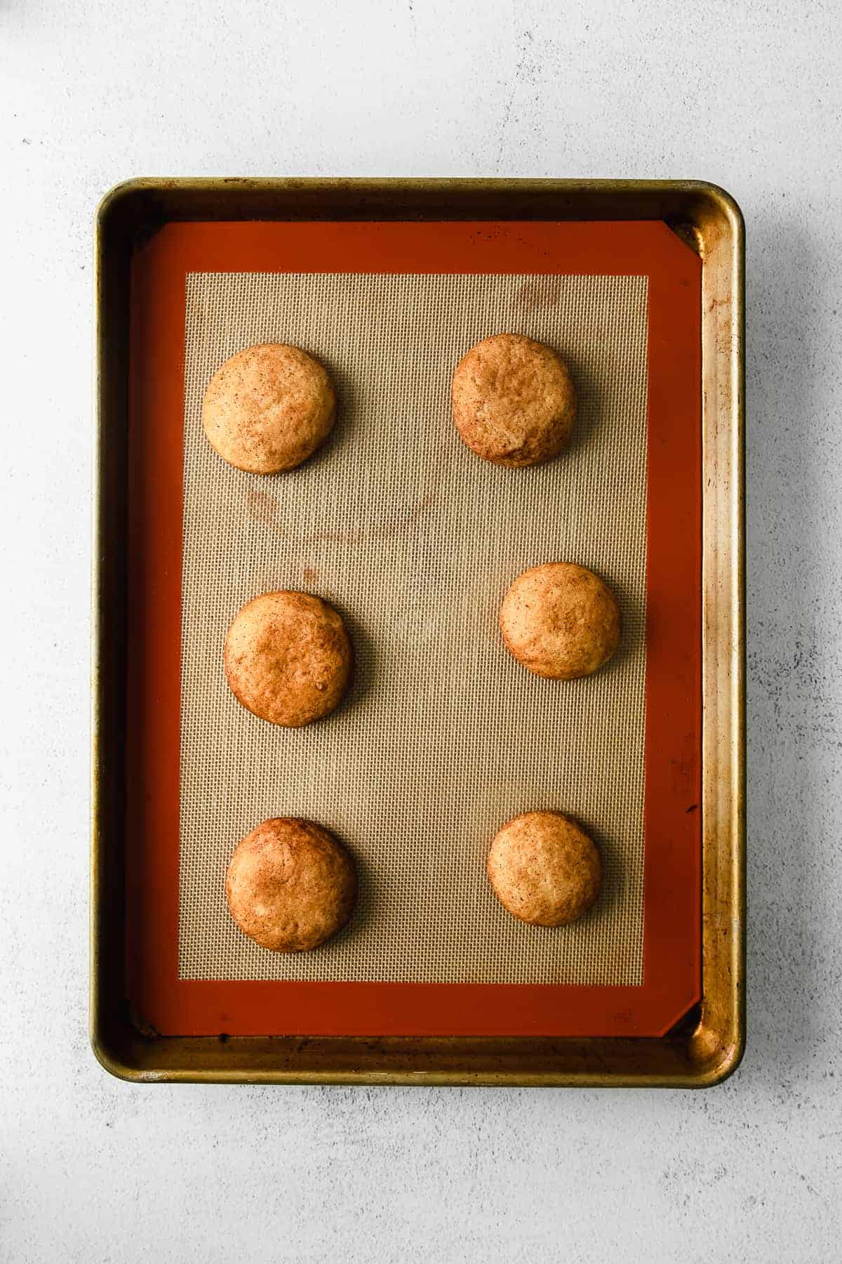 Snicker doodles on a baking sheet. 