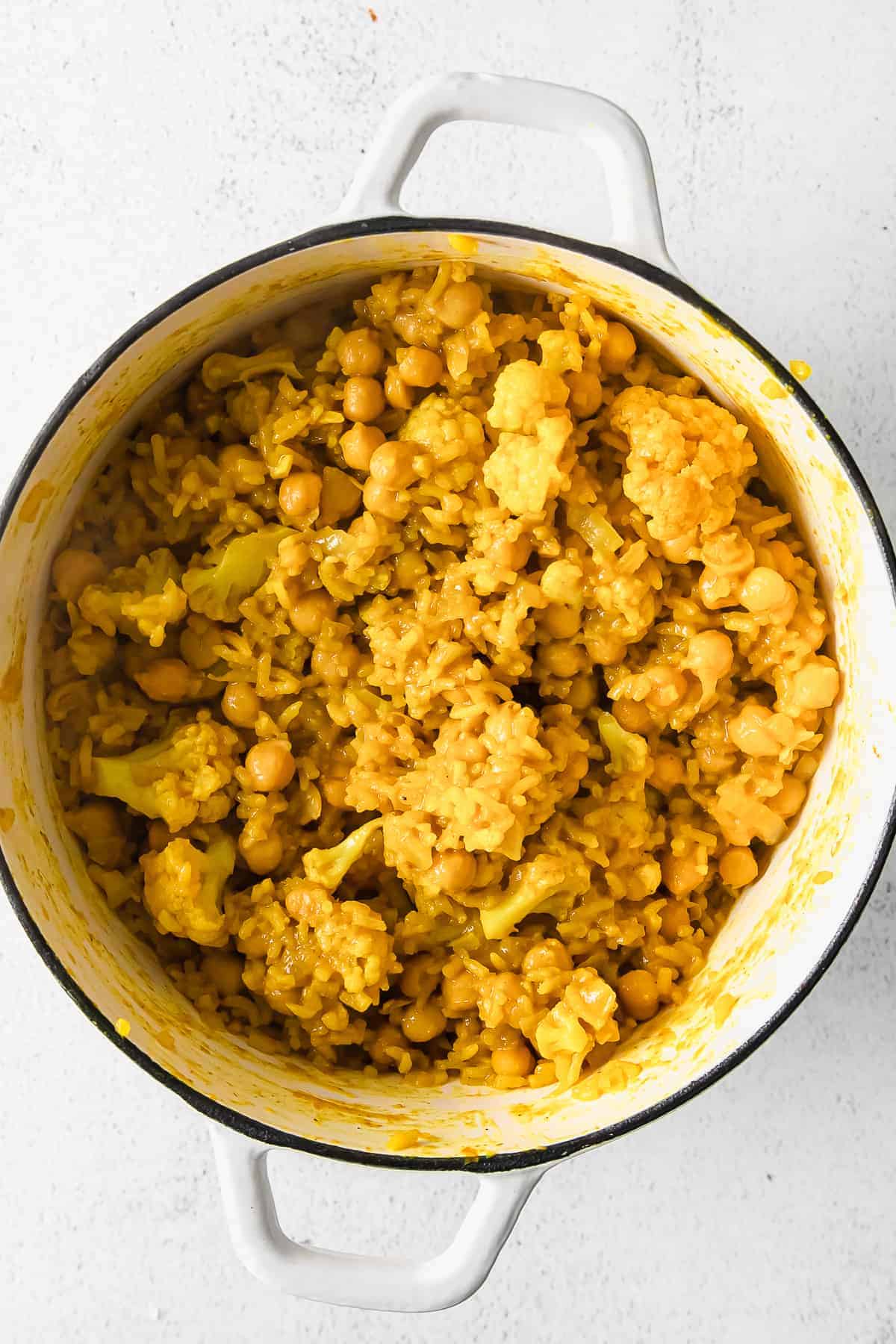 Cooked rice, beans, and cauliflower. 