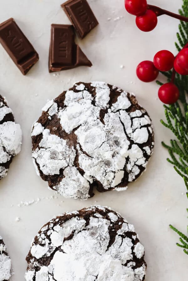 Chocolate crinkle cookies with chocolate chips and red berries.