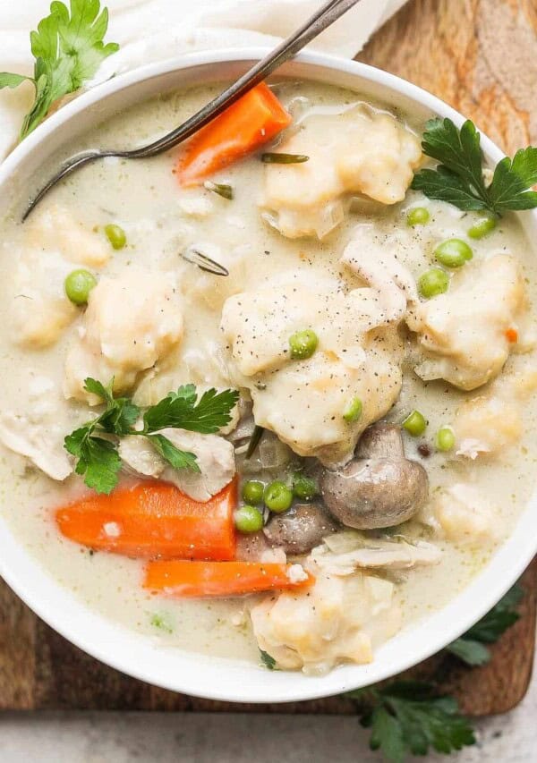 Get the best of both worlds with slow cooker chicken and dumplings! This recipe makes tender, moist chicken and small dumplings that are perfect. This is a great weeknight comfort meal!