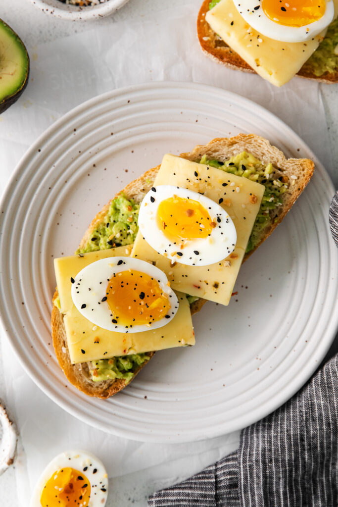 soft boiled eggs on top of avocado toast