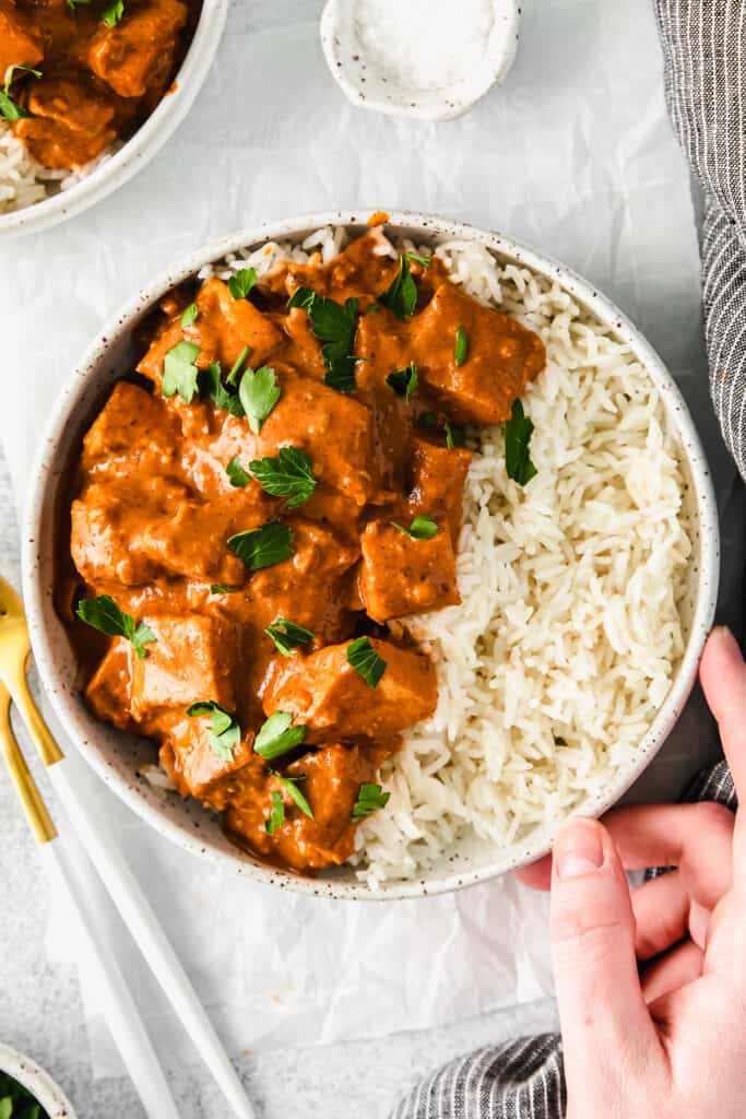 Butter chicken served over rice. 
