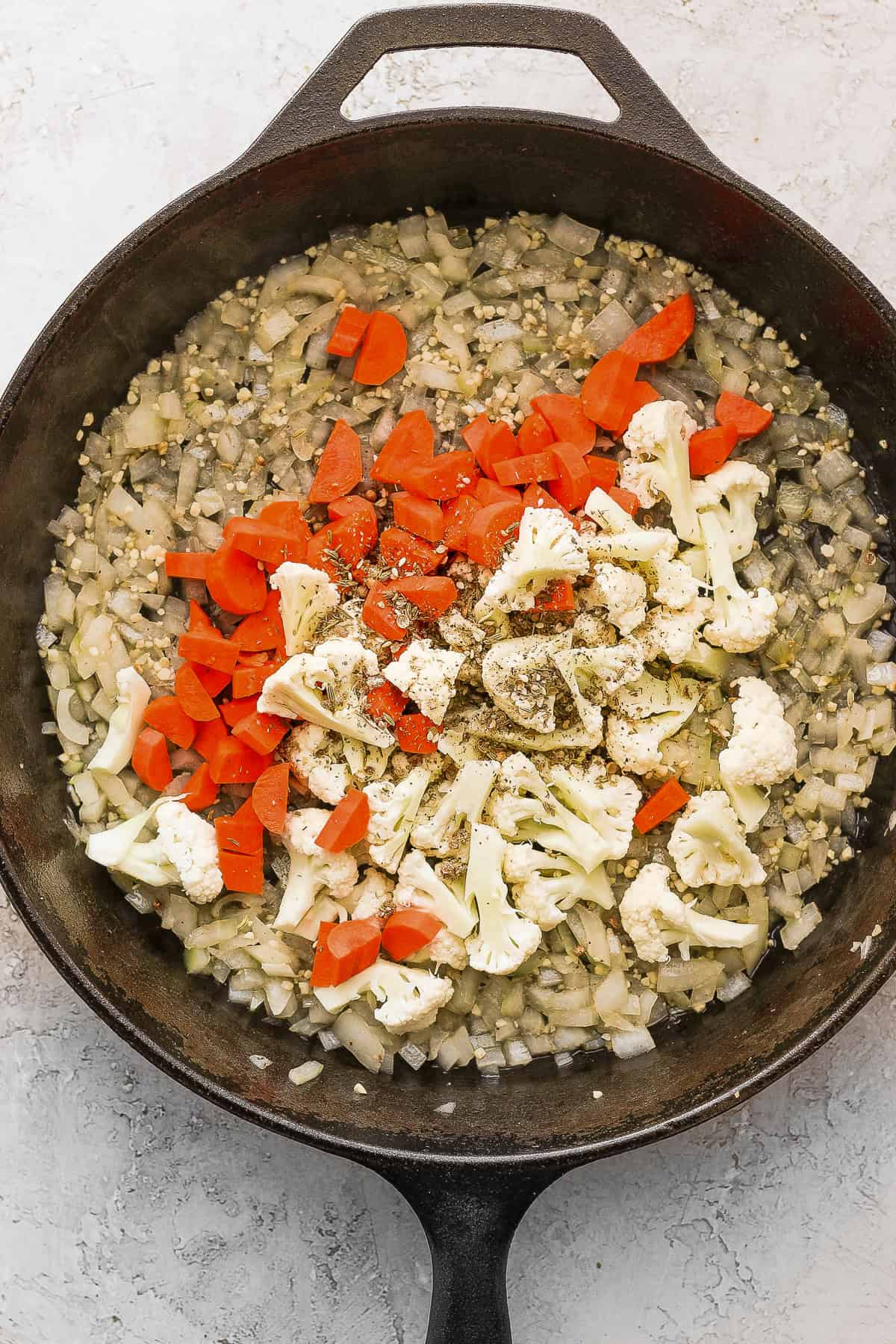 Sautéing veggies in a cast iron skillet. 