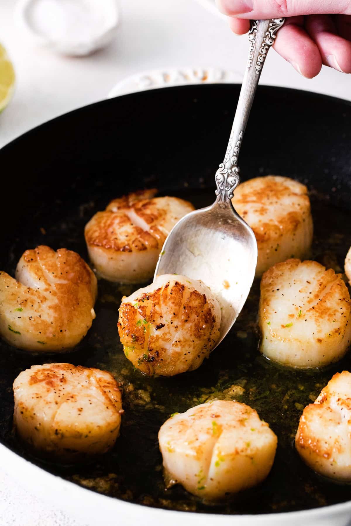 Pan seared scallops in a cast iron pan. 