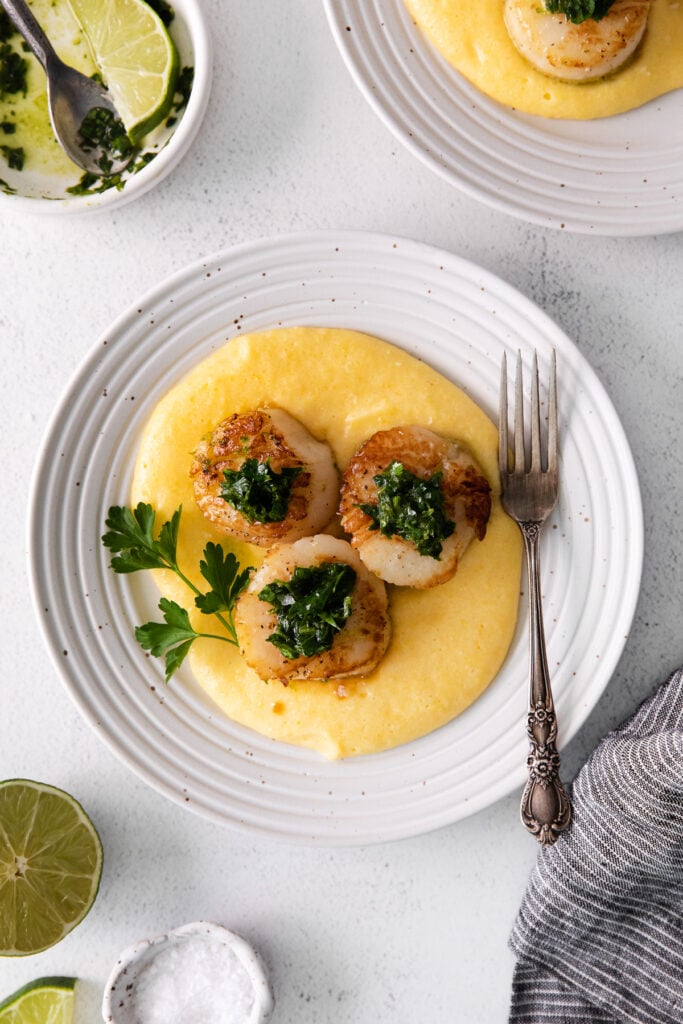Pan seared scallops served over polenta. 