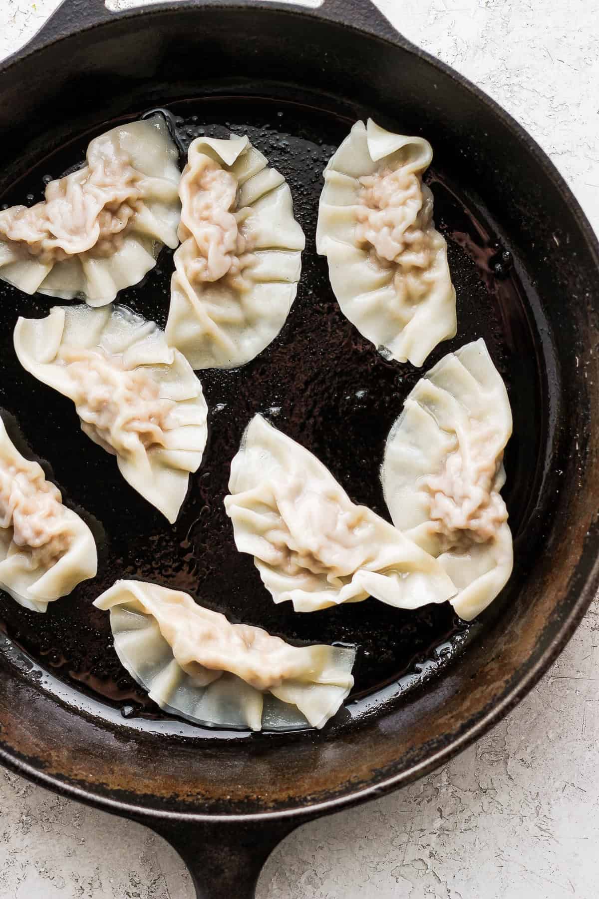 pork dumplings in a cast iron skillet