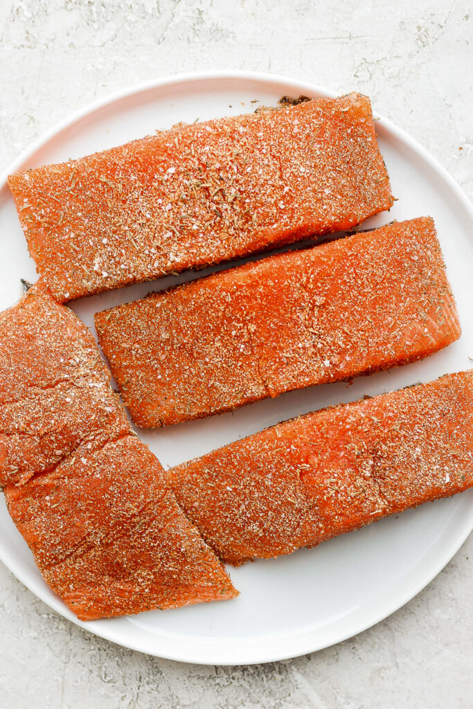 salmon filets with salmon seasoning on a plate