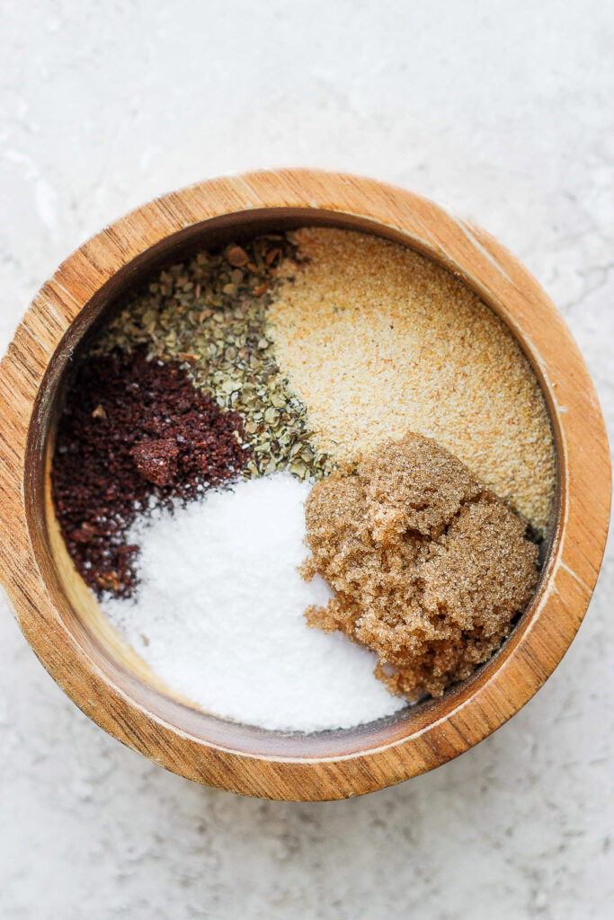 ingredients for za'atar seasoning in a mortar and pestle
