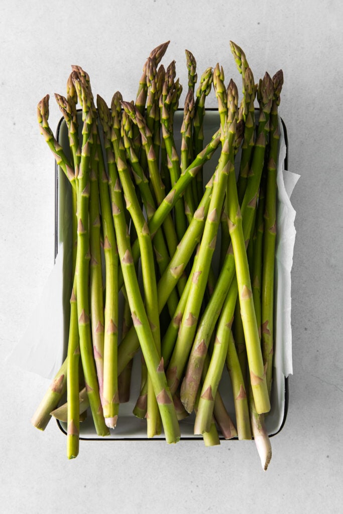 Fresh asparagus in a tray.