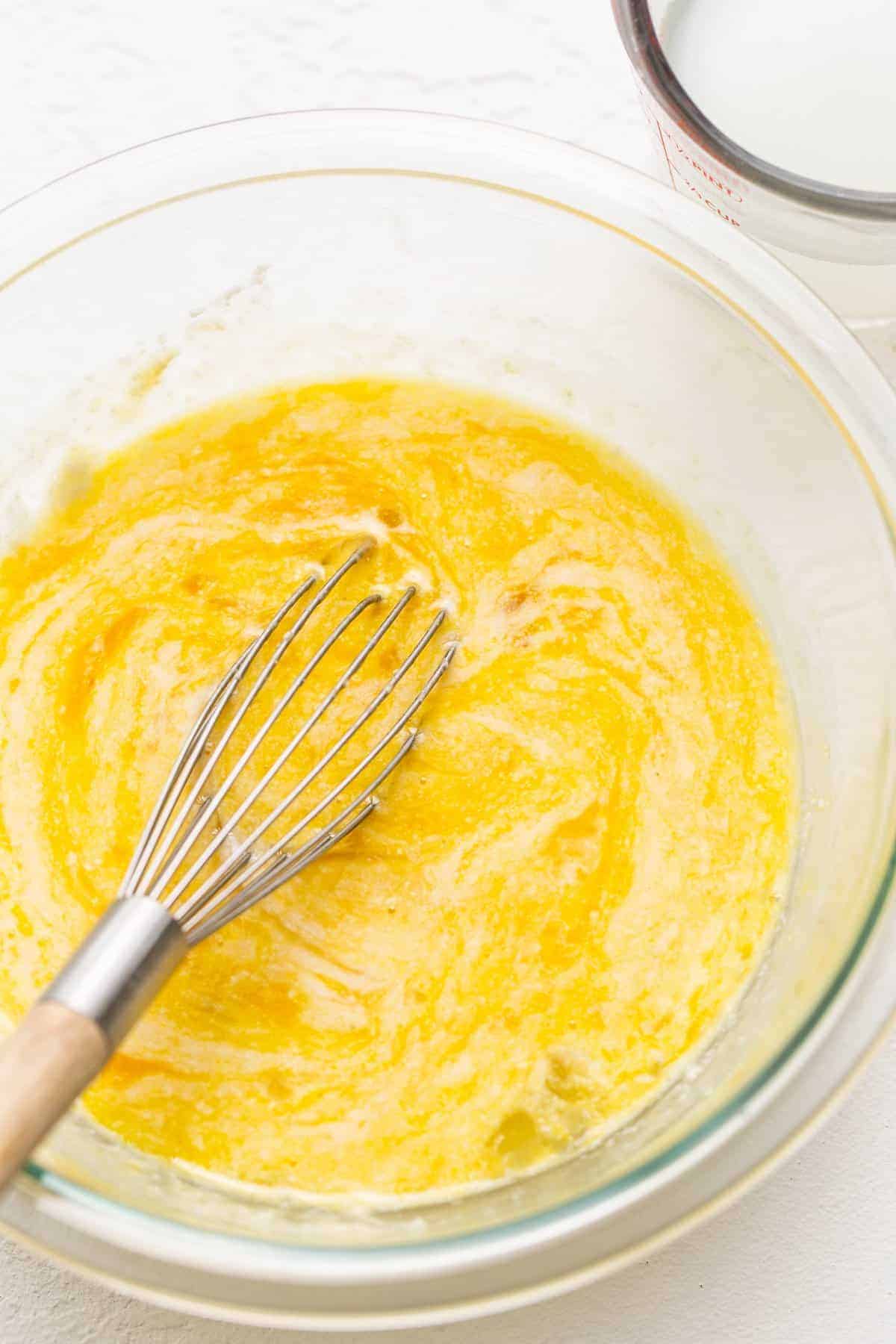 Whisked eggs in a bowl for chicken carbonara.